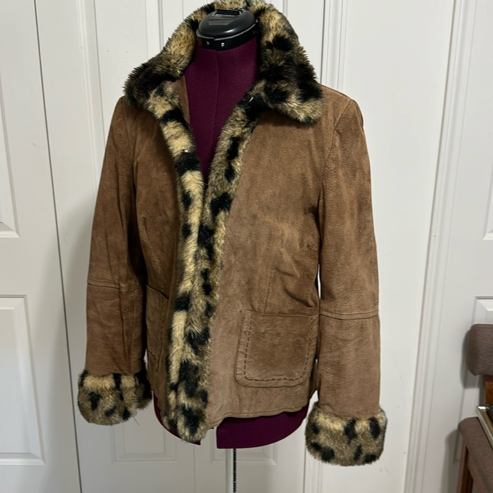 Suede woman’s jacket with faux fur collar and lapel.